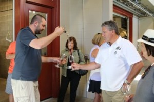 Alexana winemaker Bryan Weil sharing barrel tastes.