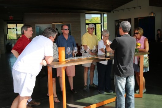 Our group gathers around to hear Santos talk about Saffron Fields.