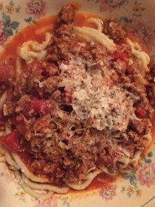 Mild sausage, ground turkey, seasoned tomatoes, crushed tomatos, garlic, onion, splash of red wine, beef broth and cook the heck out of it!